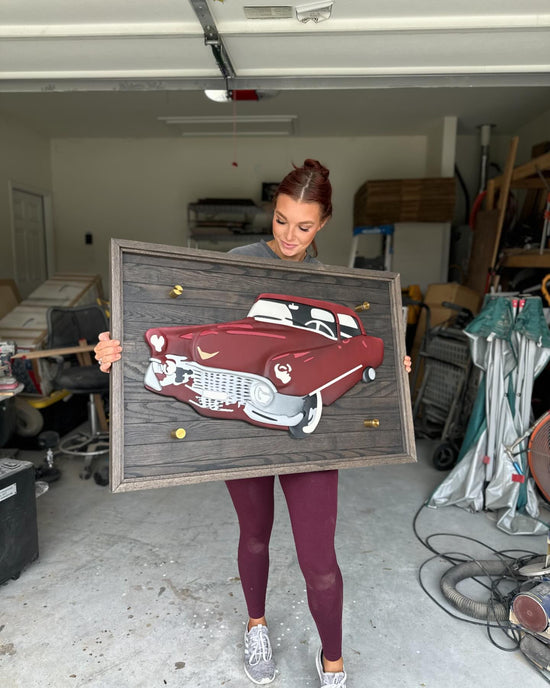 wood sign with red old car