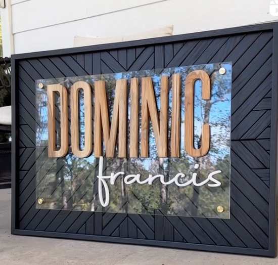 Dominic Francis black geometric design with wood lettering and black frame