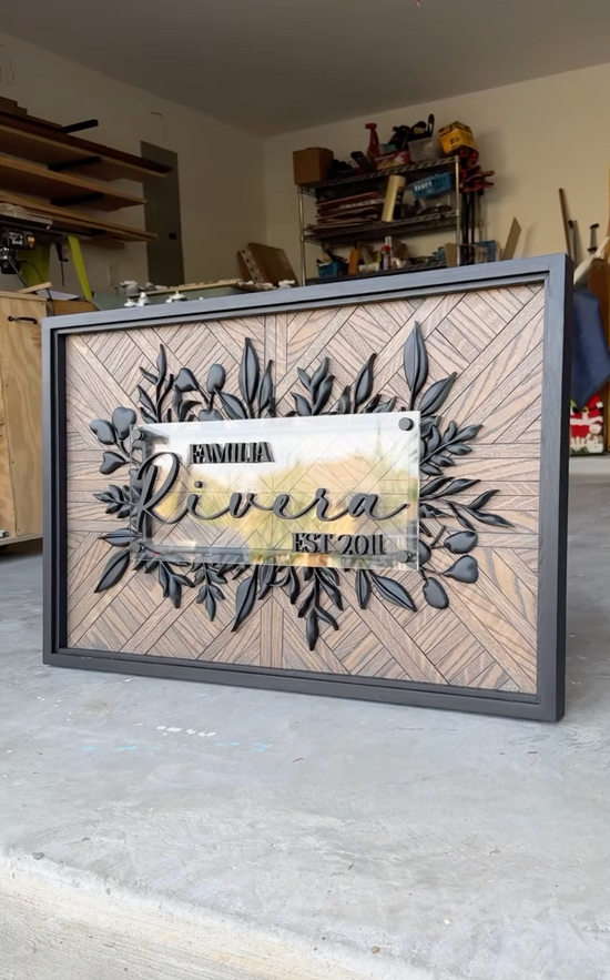 Familia Rivera EST 2011 wooden pattern background and black frame with black greenery border