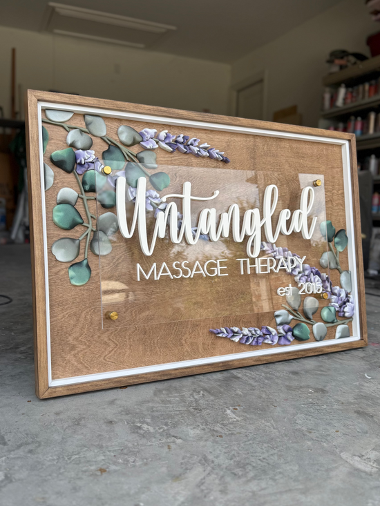Untangled Massage Therapy logo sign with wood and lavender