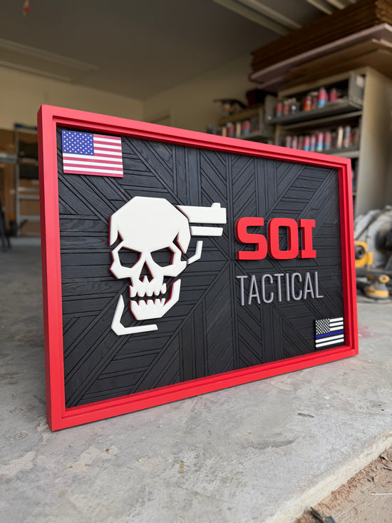 SOI tactical logo sign with flags, skull, red double border and mosaic patterned black backer