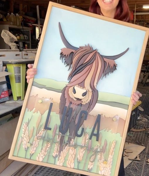 Luca Anthony Highland cow sign with wood frame and wheat grass