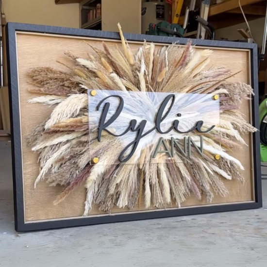 Pampas Grass Sign Rylie Ann wooden background black frame in garage