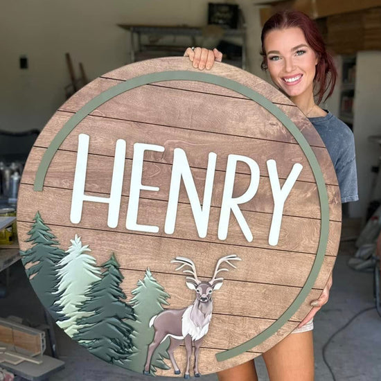 The Hunter Round with deer and trees with wood shiplap pattern and Henry name