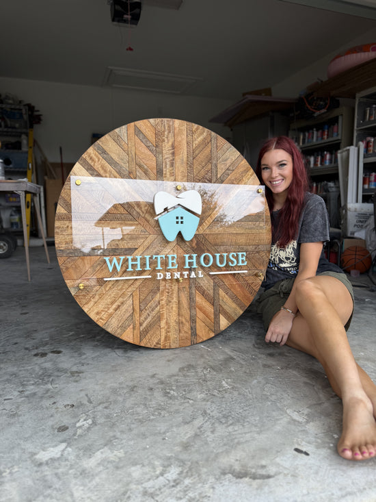 White house dental logo sign with mango wood background